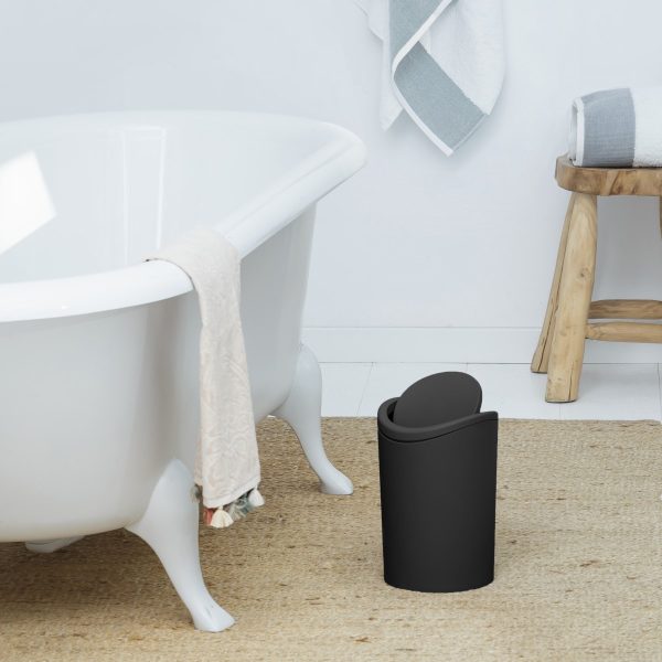 Bathroom wastebasket with tilting lid